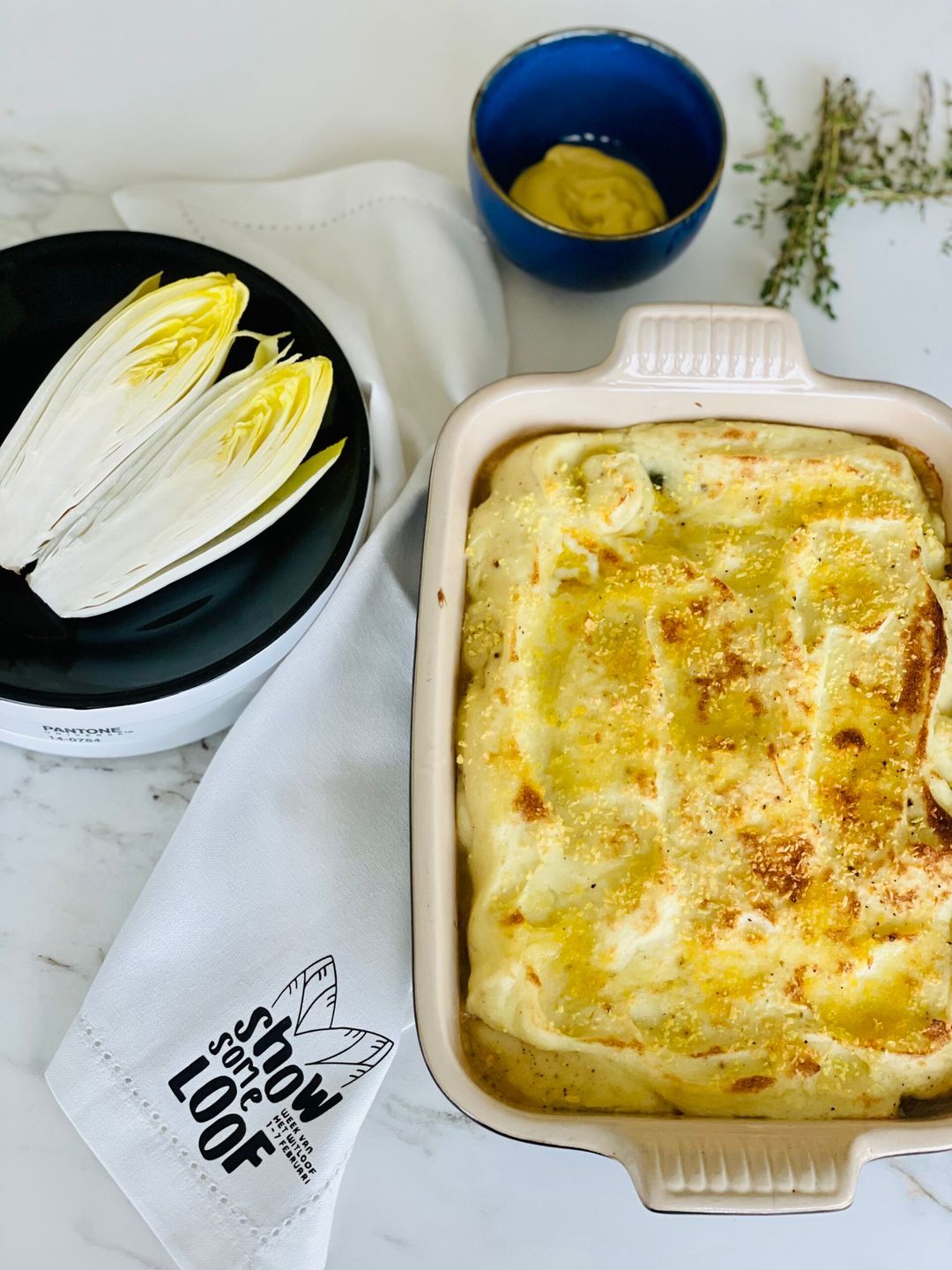 Ovenschotel met witloof, knolselderpuree en rundsgehakt